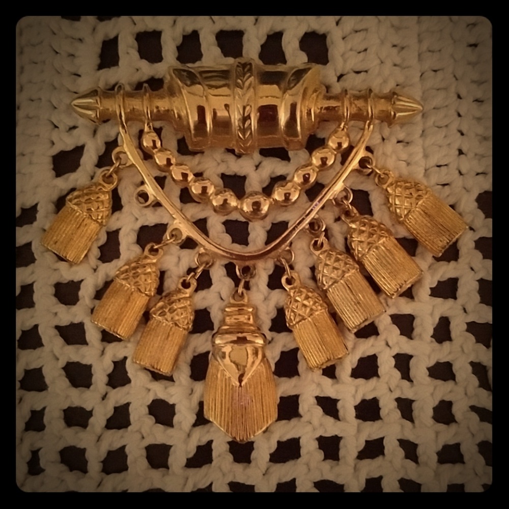 Gold colored tassel pin